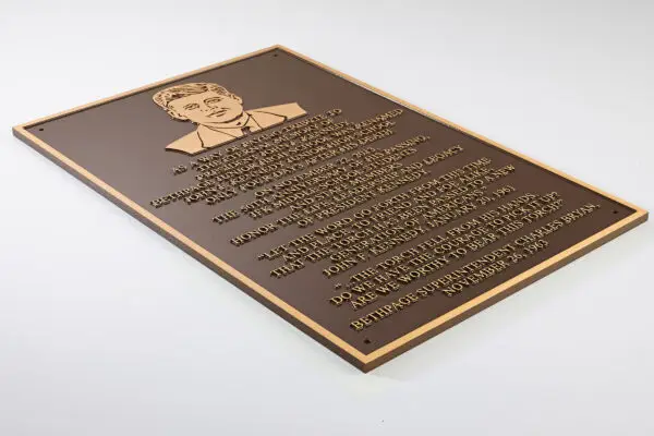 Bronze dimensional plaque with raised lettering and portrait for commemorative display
