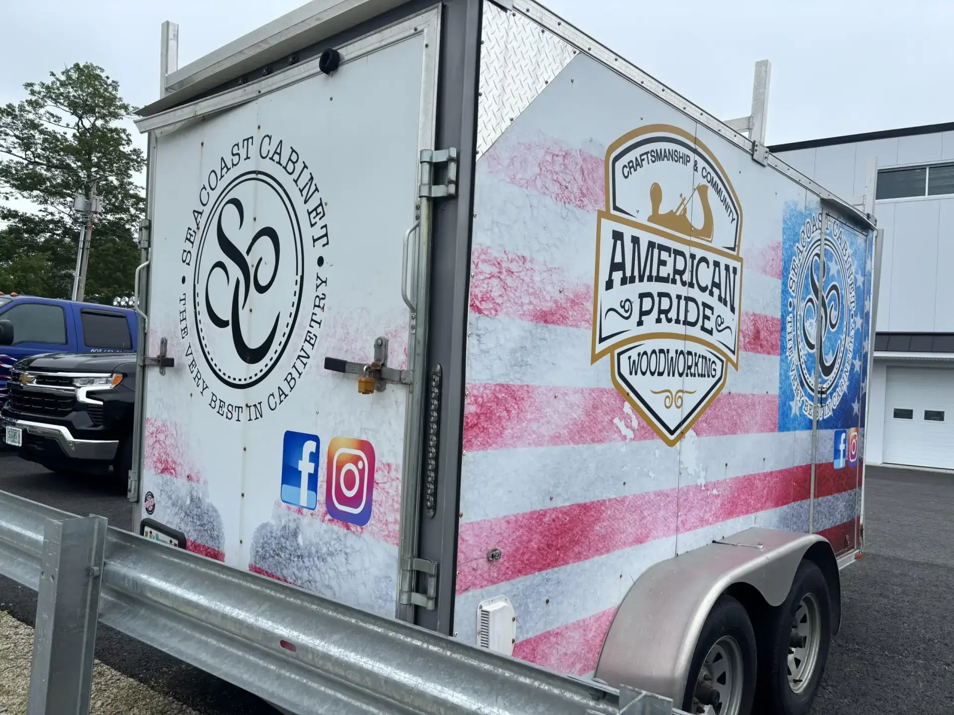 Trailer wrap featuring Seacoast Cabinet logo and American Pride Woodworking branding with a red, white, and blue striped background, showcasing vehicle graphics for consistent fleet branding.
