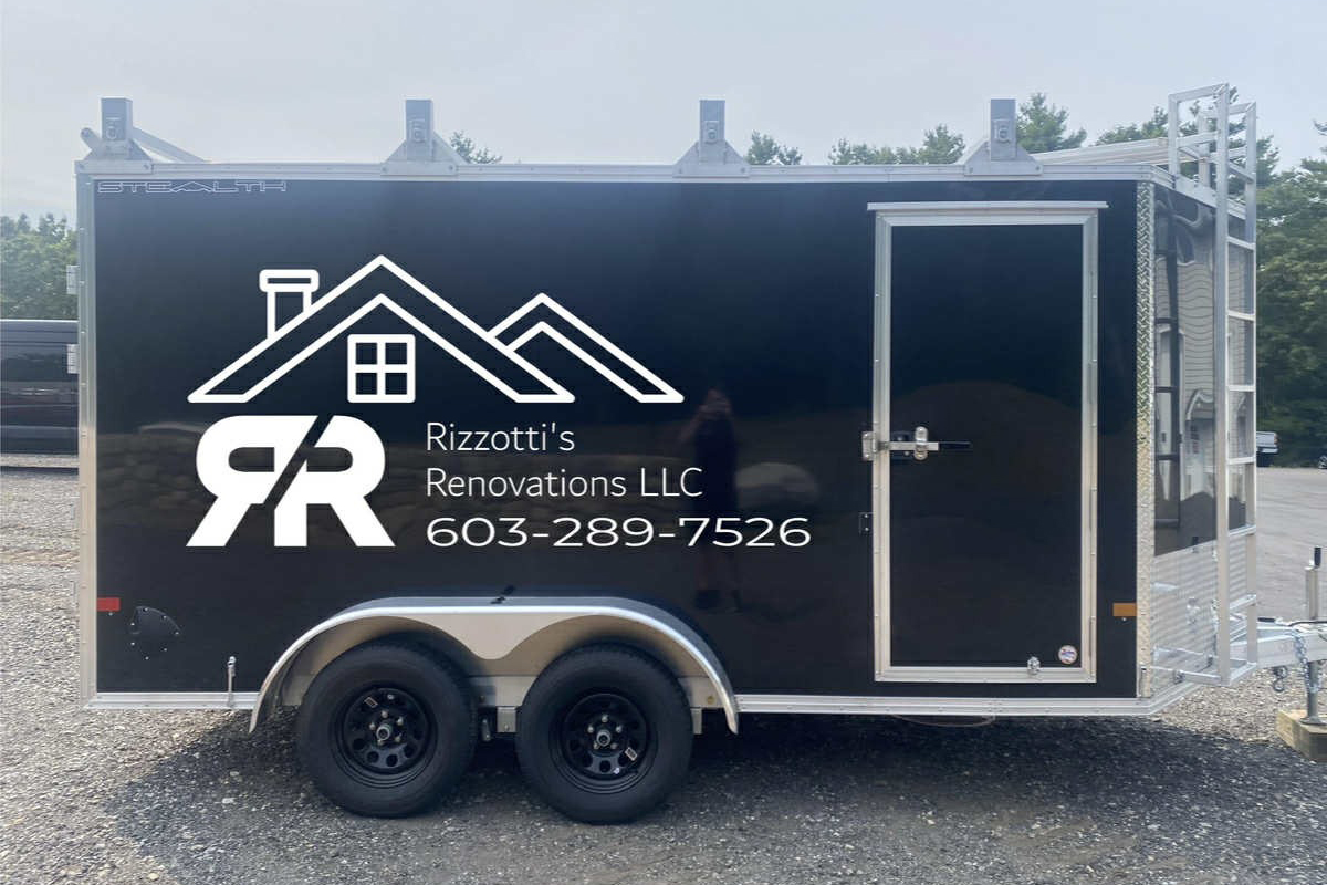 Black trailer with Rizzotti's Renovations LLC logo, contact number, and house graphic design, showcasing vehicle graphics and branding services.