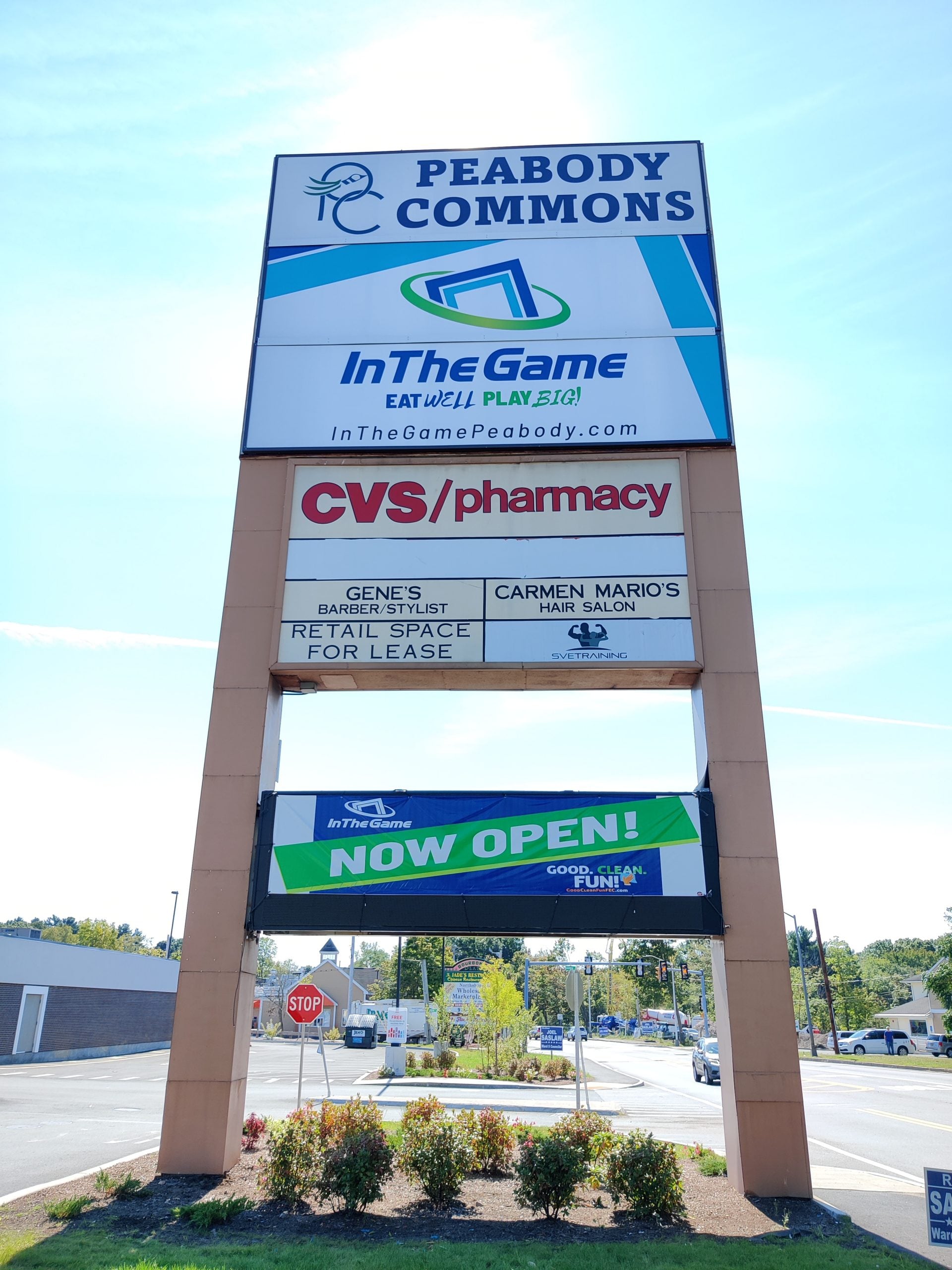 Pylon sign for Peabody Commons displaying tenants including InTheGame, CVS/pharmacy, and available retail space, emphasizing visibility and branding for commercial use.
