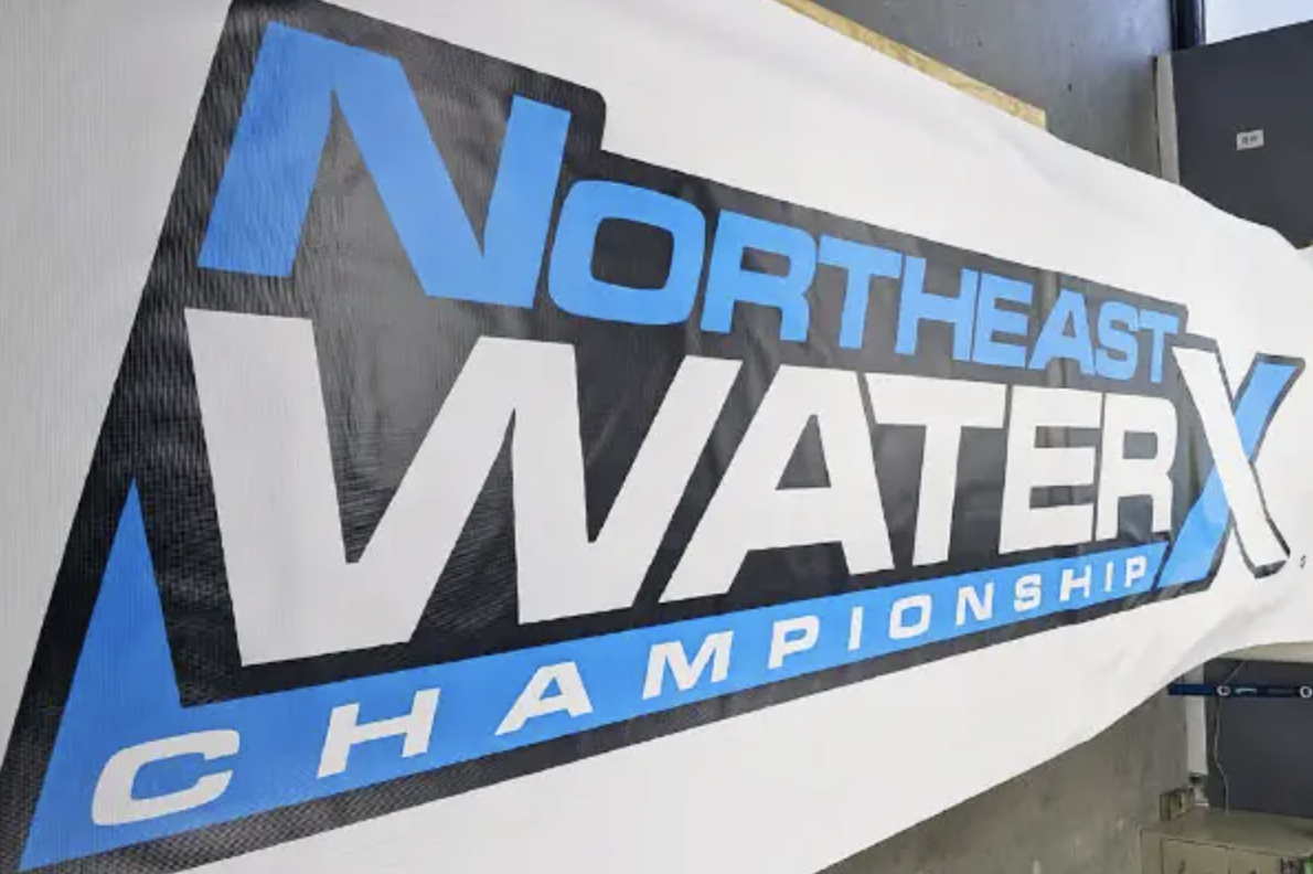 Northeast WaterX Championship vinyl banner with bold black and blue lettering, showcasing high-quality, weather-resistant printing suitable for outdoor events.