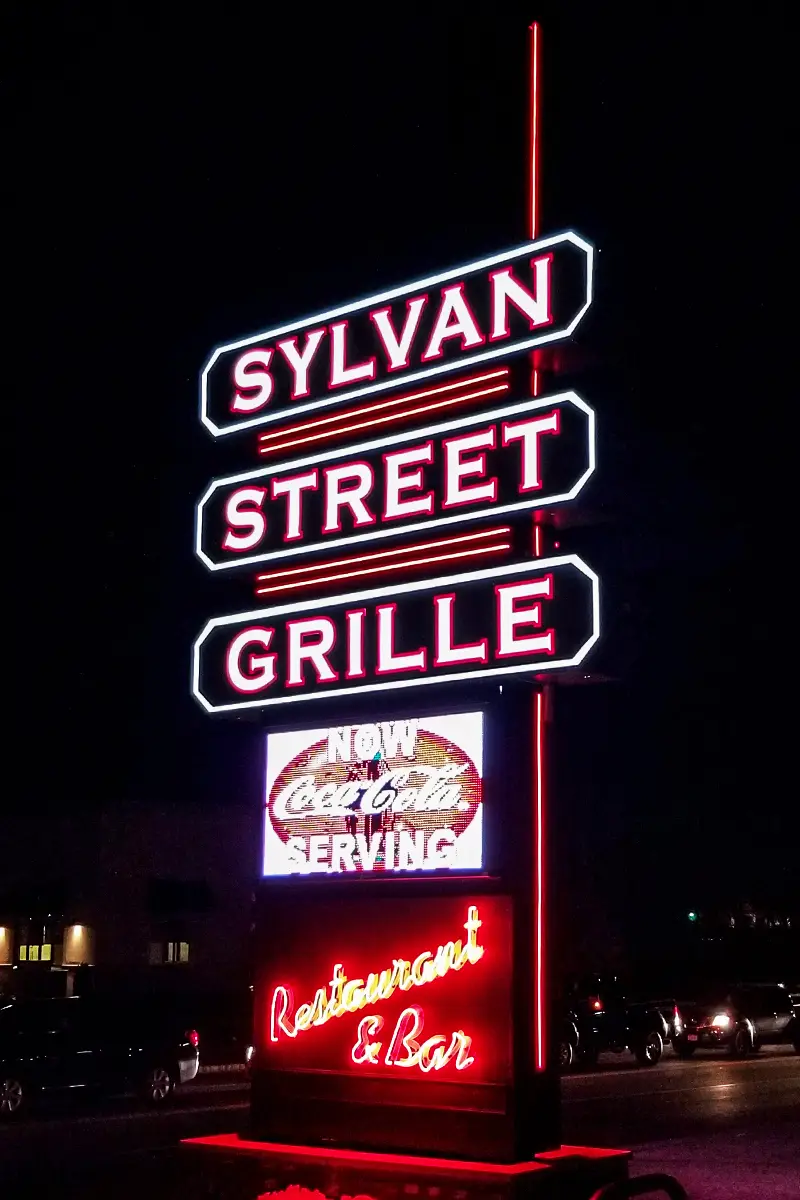 Sylvan Street Grille neon sign lit at night, Salisbury, Massachusetts