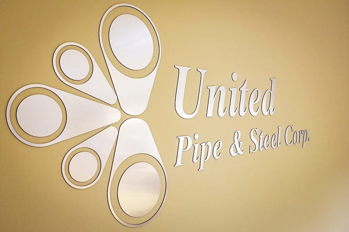 Custom wall graphic featuring the logo of United Pipe & Steel Corp, designed to enhance corporate branding in office environments.