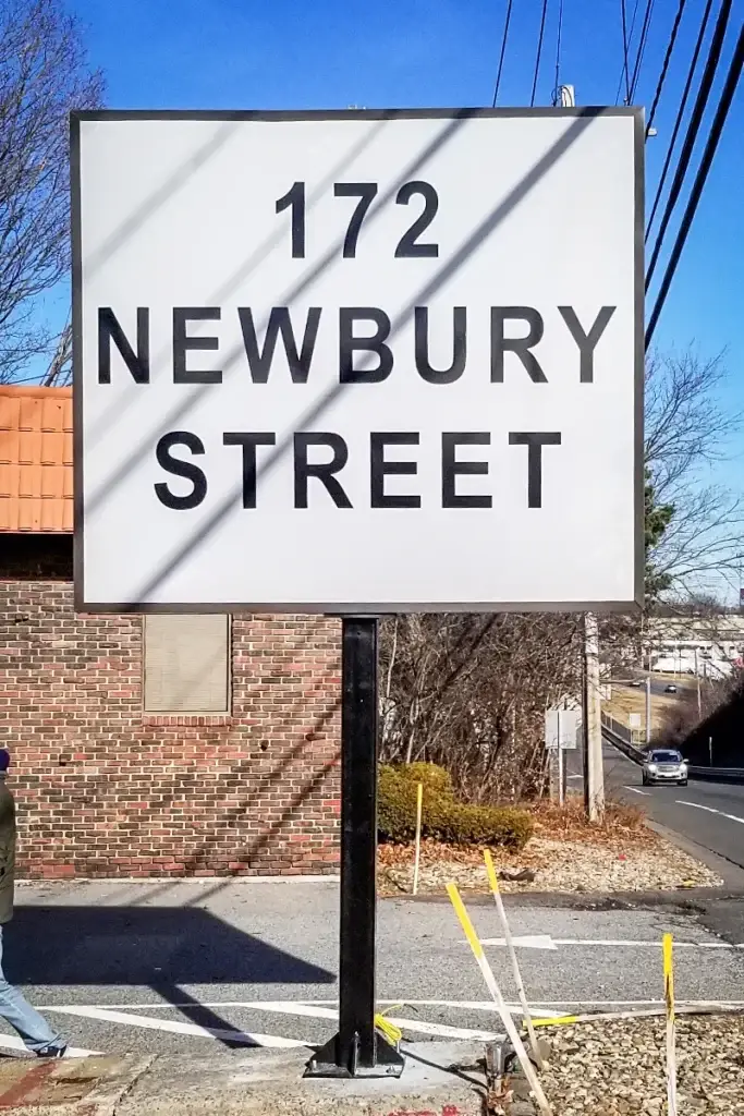Sign displaying "172 Newbury Street" on a clear day, emphasizing commercial signage solutions relevant to NH businesses.