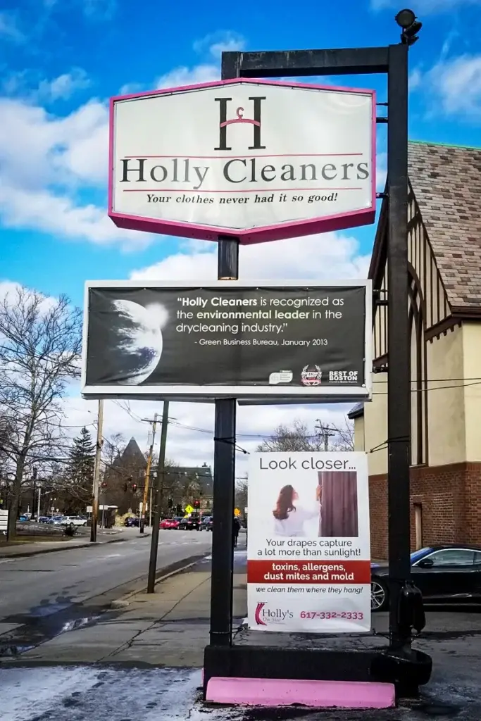 Sign repair technician restoring a vintage sign, showcasing expertise in sign repair services