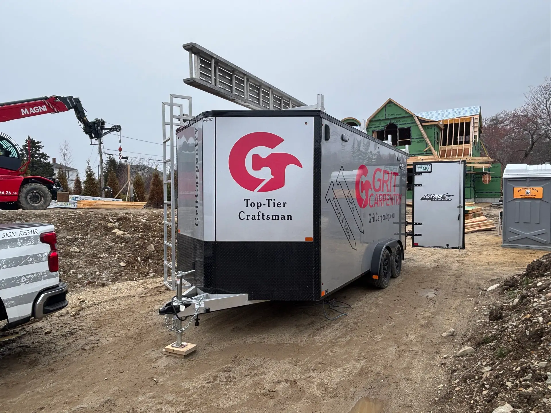 Trailer wrap for Grit Carpentry construction company, Signs East project, featuring logo and "Top-Tier Craftsman" text.